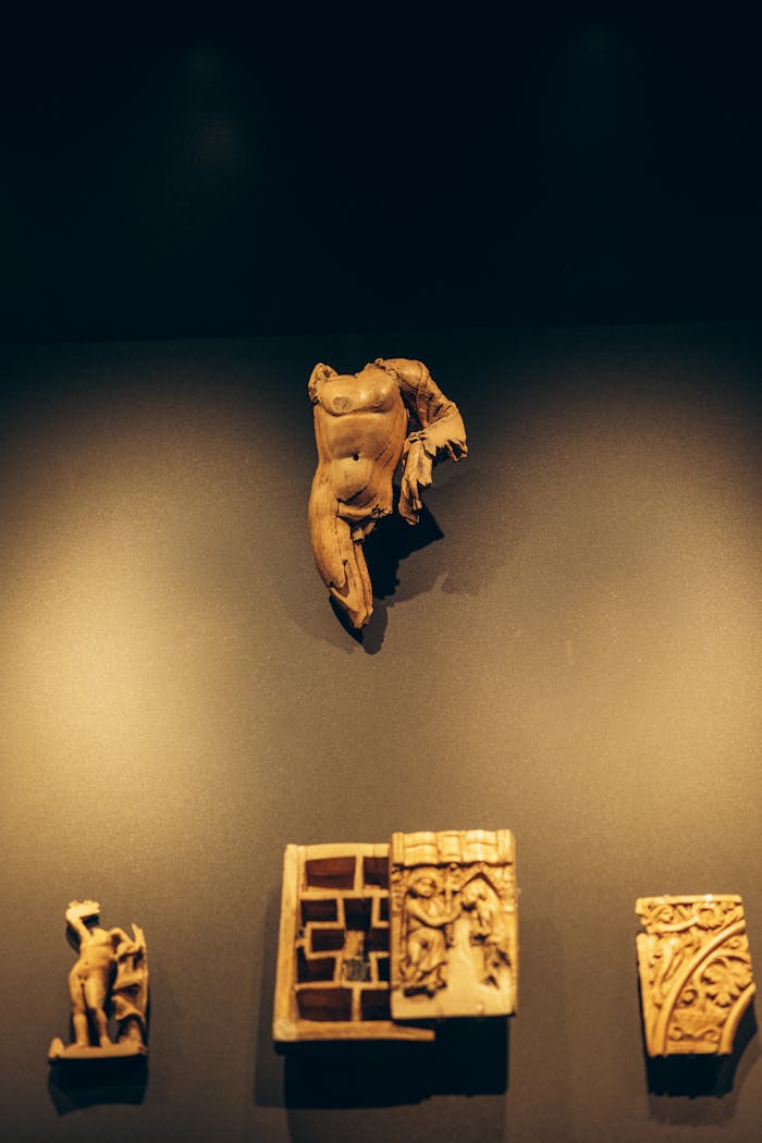 Home Intricate ancient sculptures displayed on a wall in a Turkish museum exhibit.